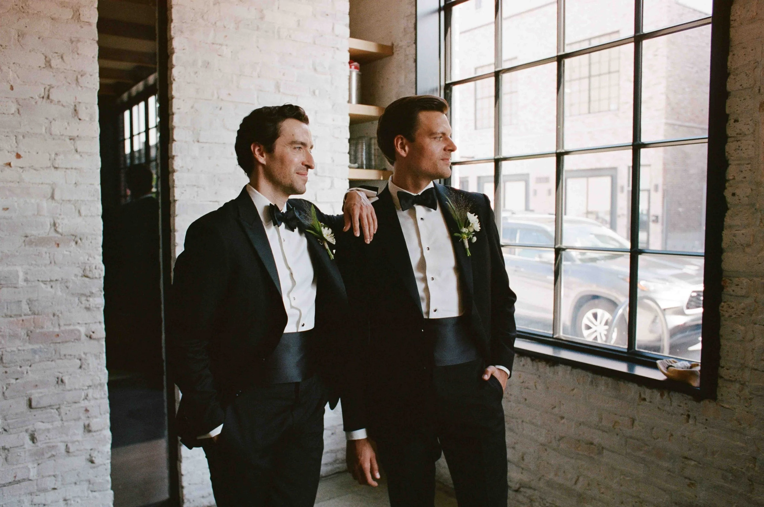 Groom and groom get married at maxwells trading with creative, lively wedding focused on community, queer family, laughter. Documentary and candid photos on analog nostalgic film. Weddings by Grace is a Chicago lesbian queer luxury wedding photograph