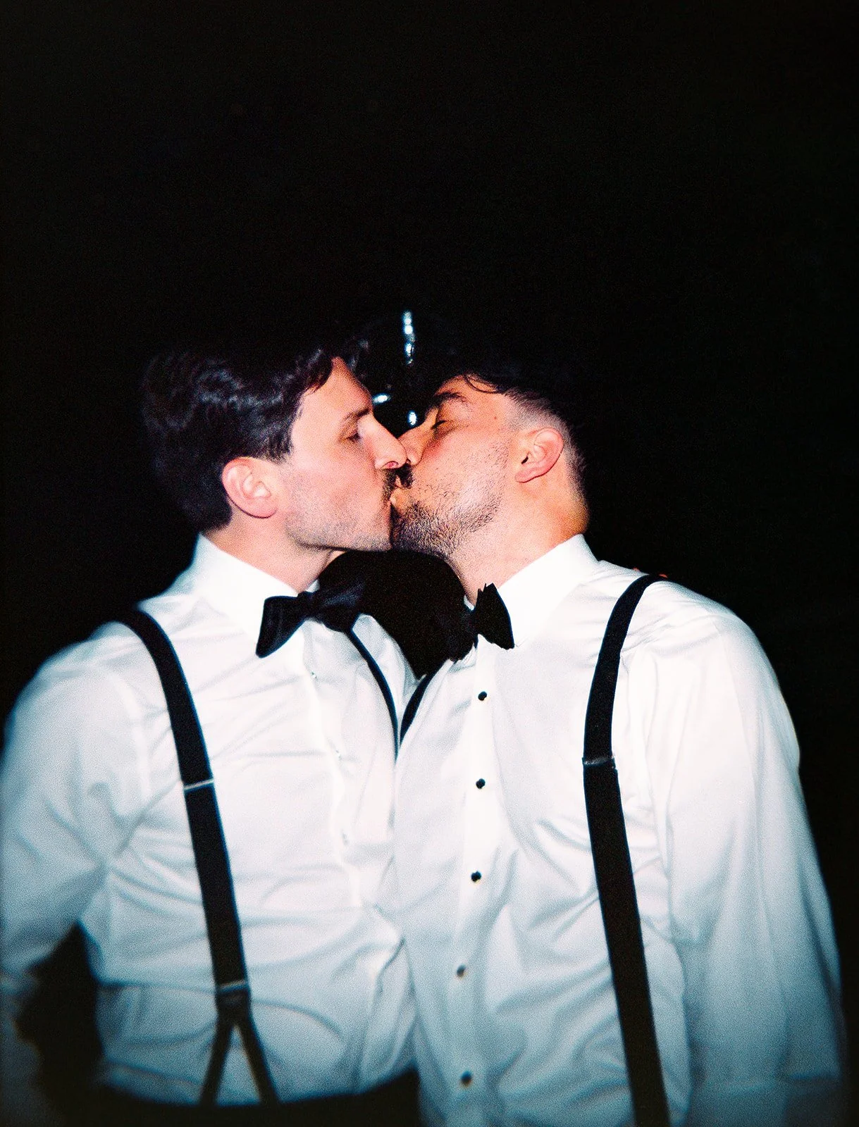 Two grooms get married downtown on Halloween night at chicago winery. Queer, gay, black tie, high-end party and drag show. Documentary and candid photos on flash film. Weddings by Grace is a Chicago lesbian queer luxury wedding photographer specializ