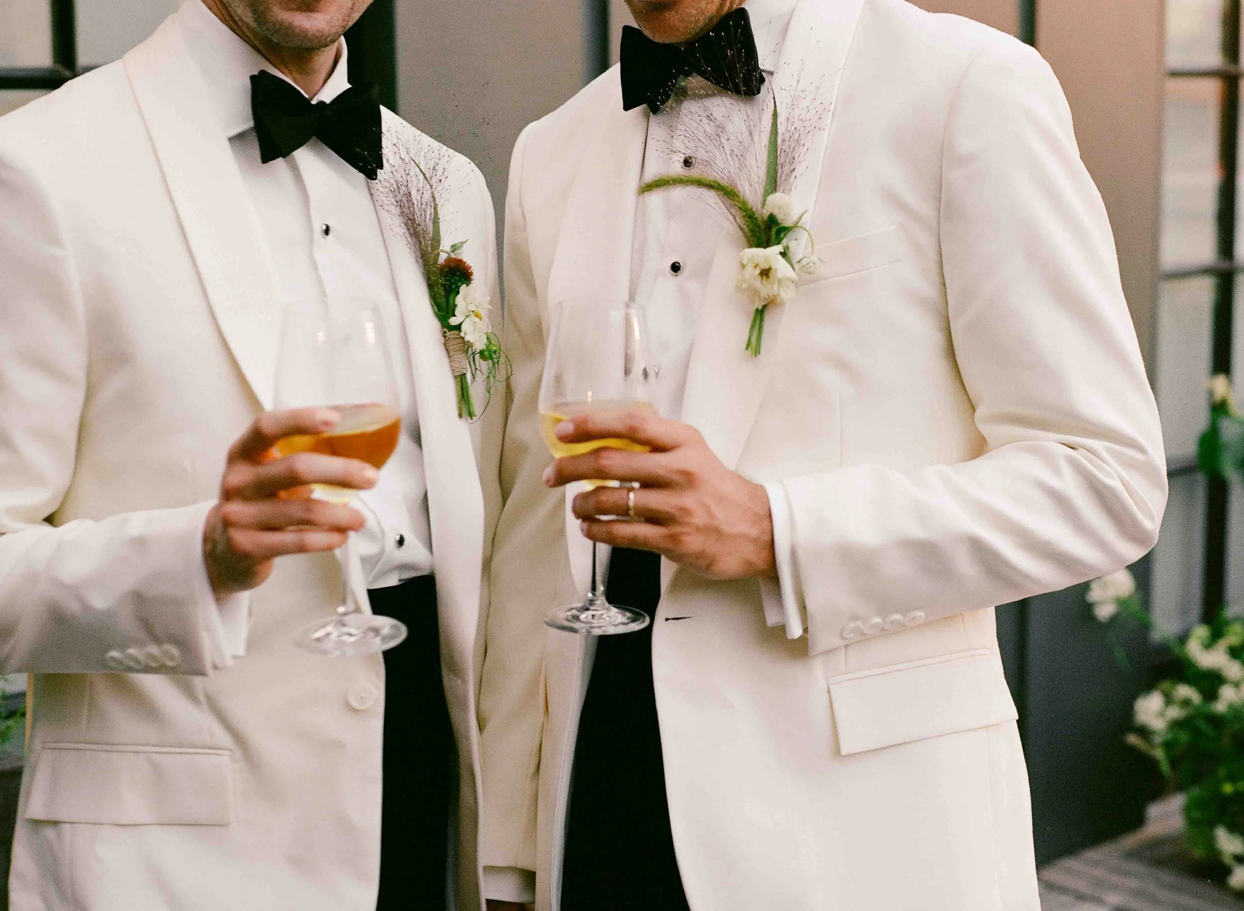 Groom and groom get married at maxwells trading with creative, lively wedding focused on community, queer family, laughter. Documentary and candid photos on analog nostalgic film. Weddings by Grace is a Chicago lesbian queer luxury wedding photograph