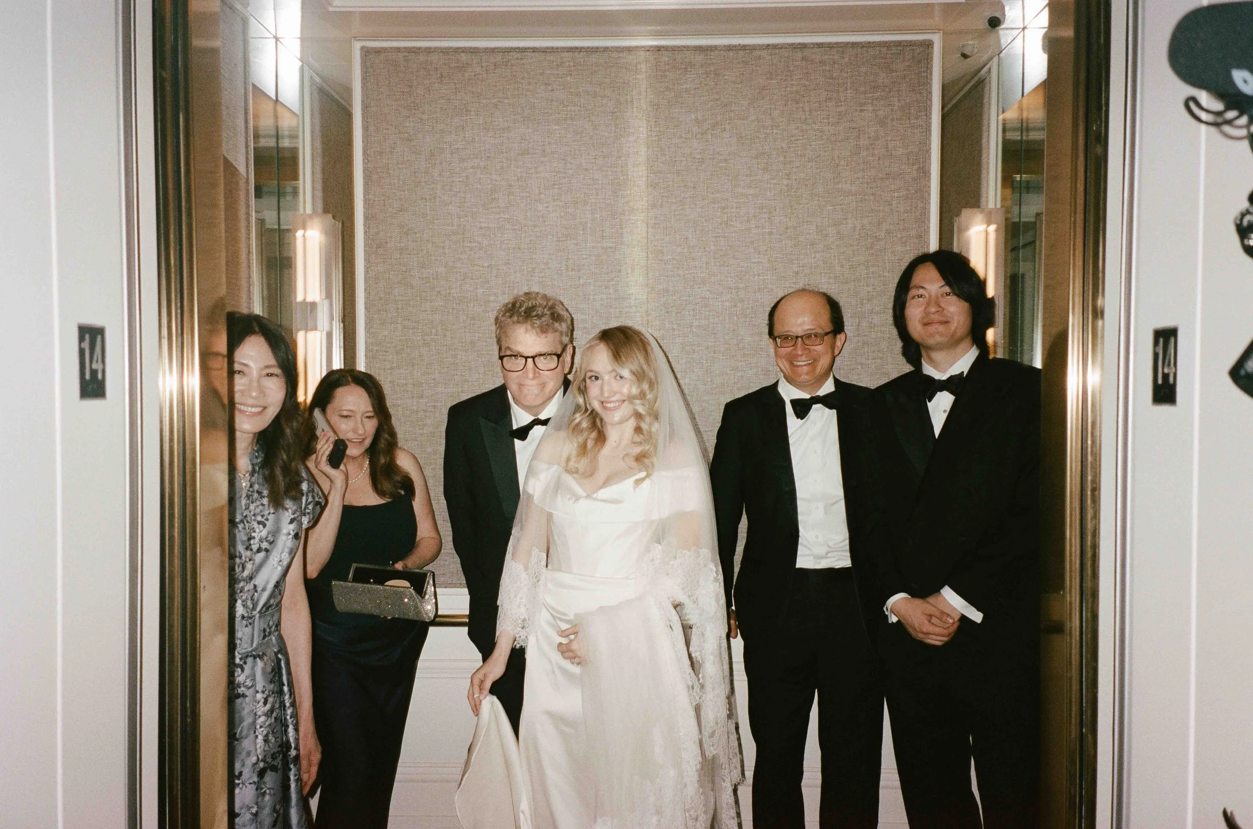 Bride and groom get married at the Chicago History Museum, with creative, lively wedding focused on community, family, laughter. Documentary and candid photos on analog nostalgic film. Weddings by Grace is a Chicago lesbian queer luxury wedding photo