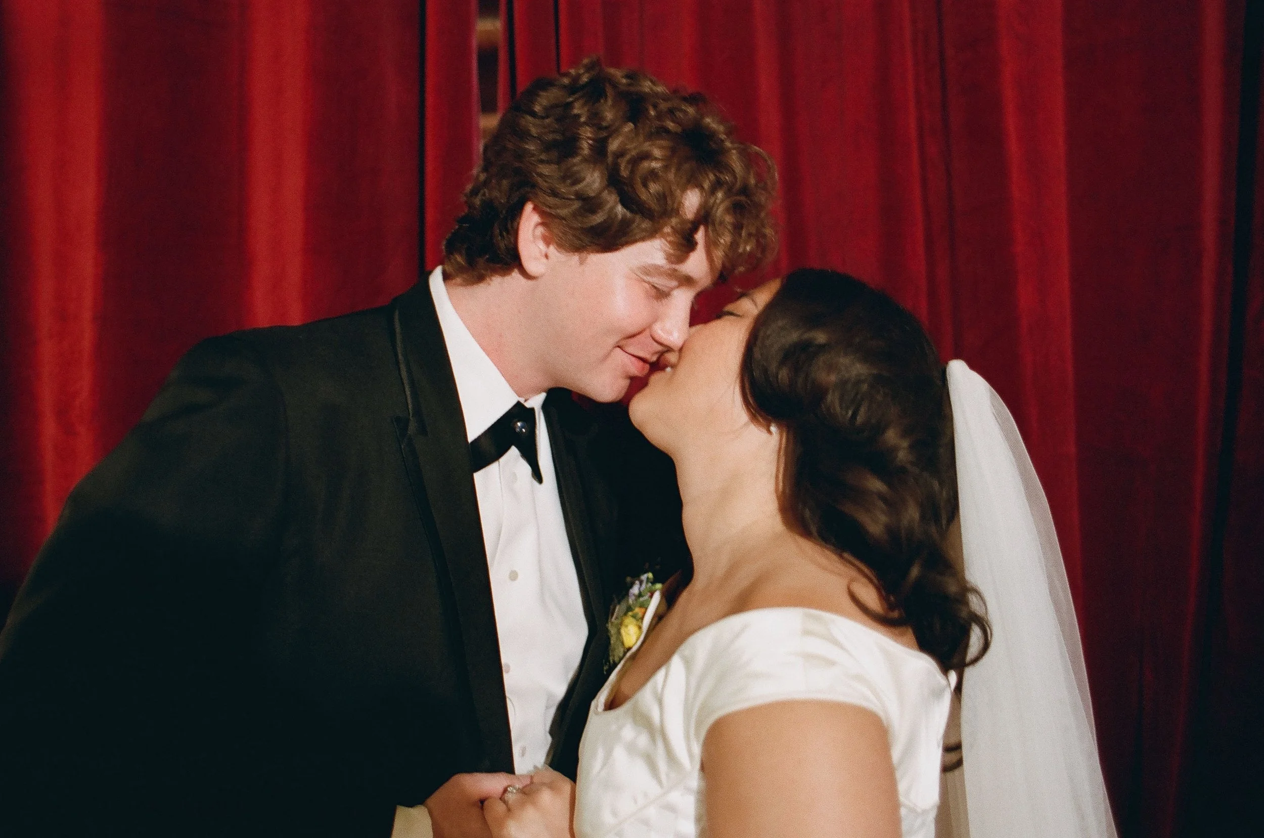 Bride and groom get married in Chicago at Salvage One, with creative, lively wedding focused on community, family, laughter. Documentary and candid photos on analog nostalgic film. Weddings by Grace is a Chicago lesbian queer luxury wedding photograp