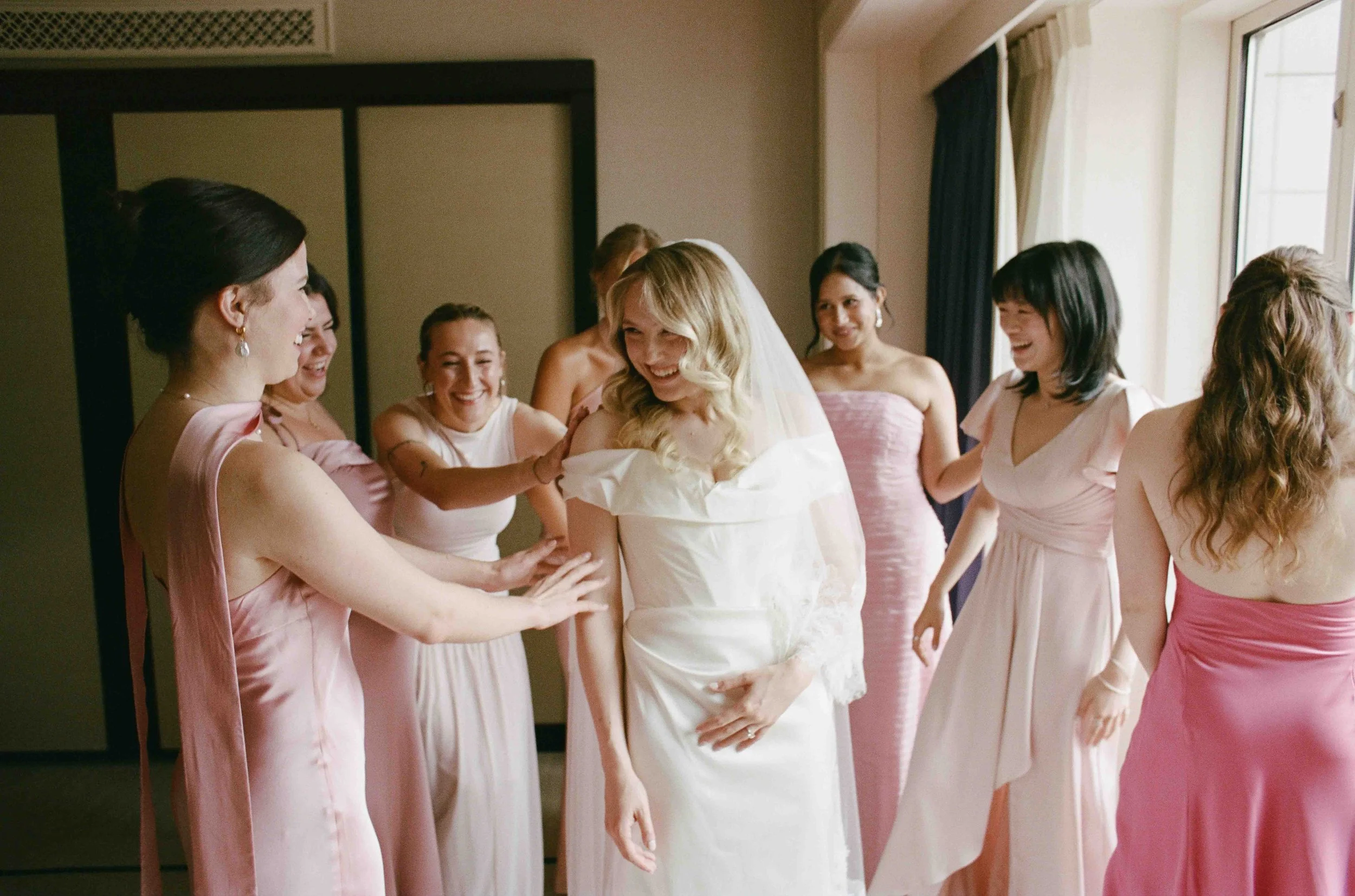 Bride and groom get married at the Chicago History Museum, with creative, lively wedding focused on community, family, laughter. Documentary and candid photos on analog nostalgic film. Weddings by Grace is a Chicago lesbian queer luxury wedding photo