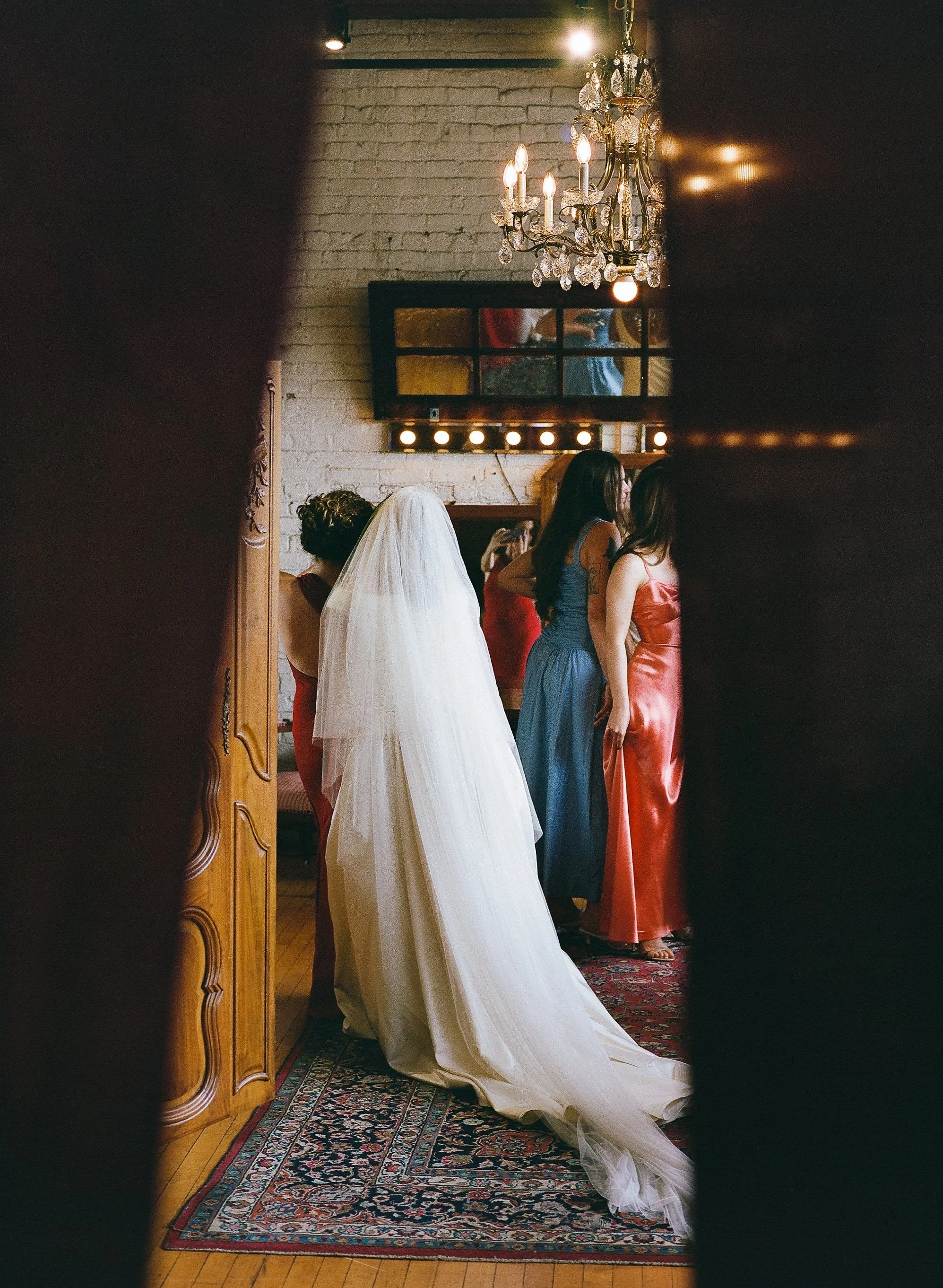 Bride and groom get married in Chicago at Salvage One, with creative, lively wedding focused on community, family, laughter. Documentary and candid photos on analog nostalgic film. Weddings by Grace is a Chicago lesbian queer luxury wedding photograp