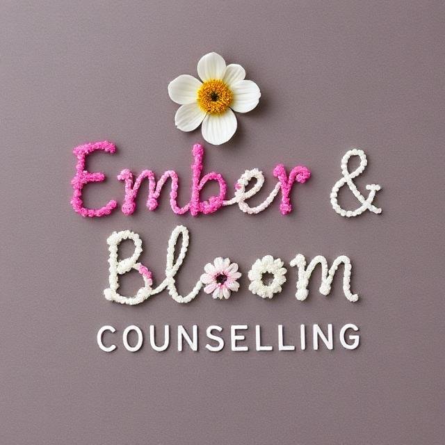 Decorative sign with pink and white floral letters spelling 'Ember & Bloom' and white letters spelling 'Counselling' against a gray background, with a large white flower on top.
