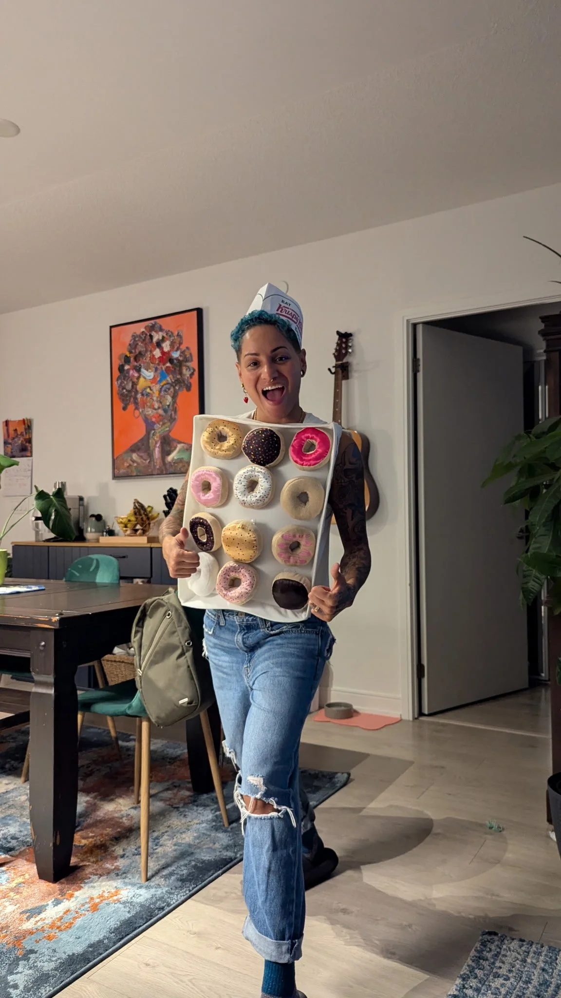 All dressed for Halloween (E wears a baker's hat and wears a box of donuts)