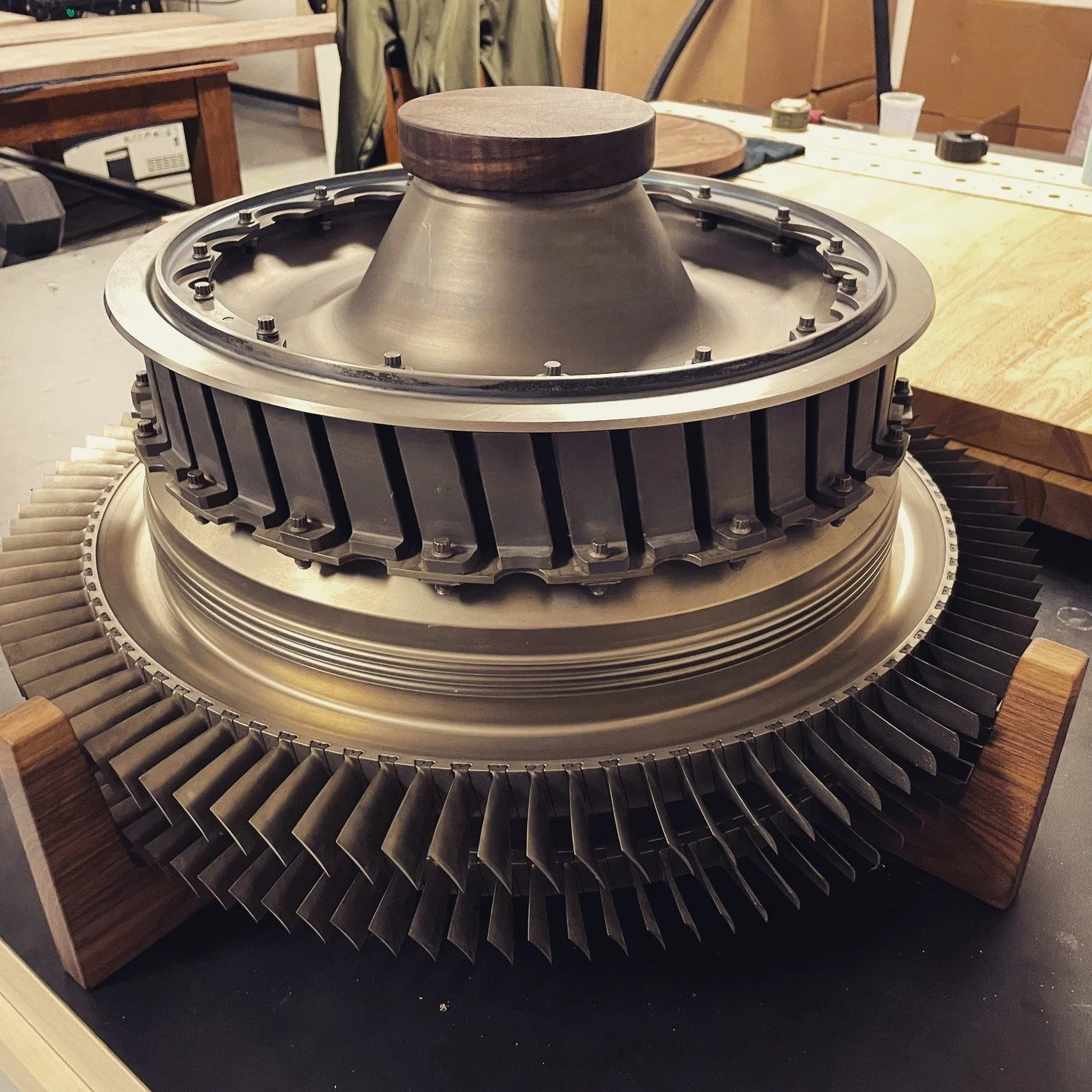 Once spinning at altitude, now stealing the show.
This cake stand features a Second Stage Fan from an LF507-1F turbofan, paired with dark walnut and finished in Rubio Monocoat Pure. Custom built for @thebombersbatch 

#AviationArt #IndustrialLuxury #