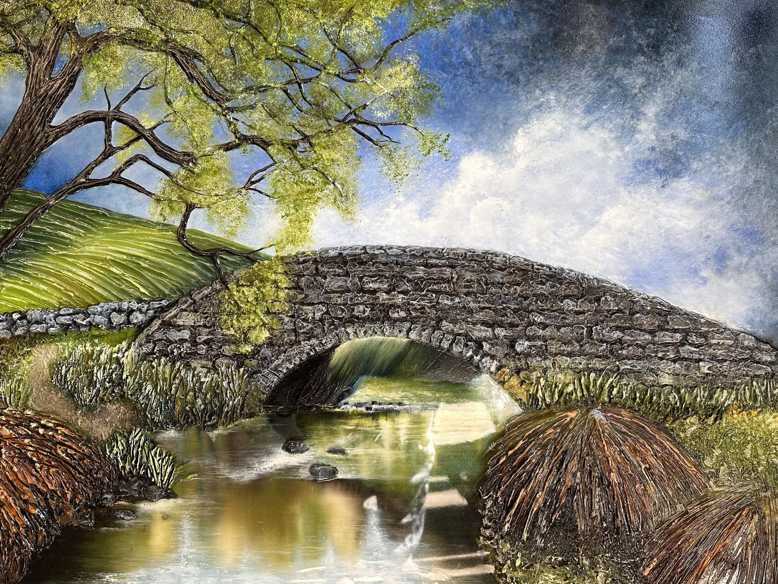 Painting of a stone bridge over a creek with a tree on the left, a grassy hill on the right, and a cloudy blue sky.