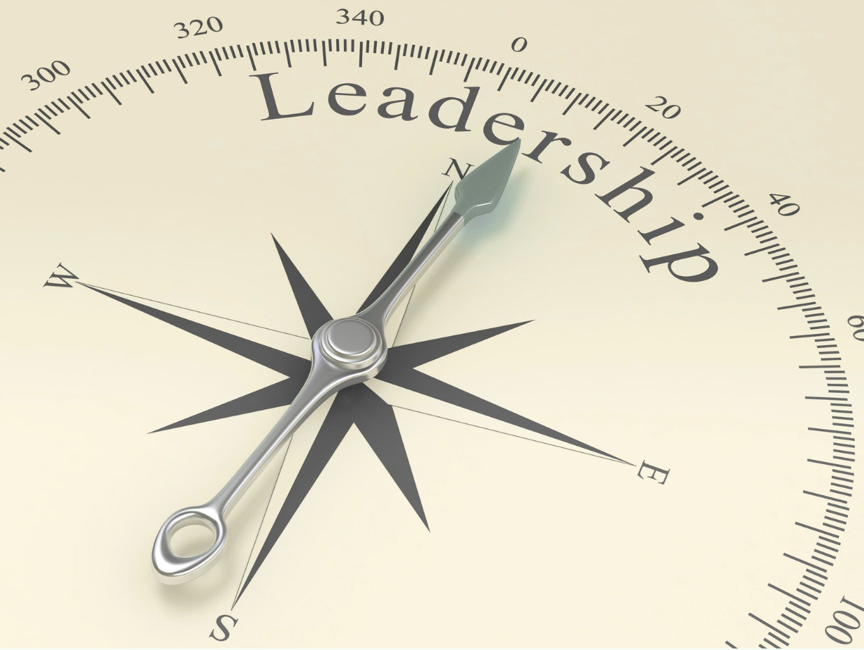 A compass with its needle pointing towards the word 'Leadership' at the top, symbolizing guidance and direction.