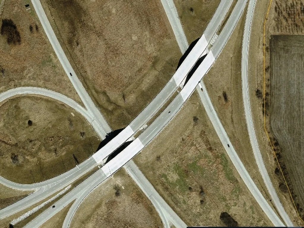 An aerial view of a highway interchange with multiple roads and bridges.