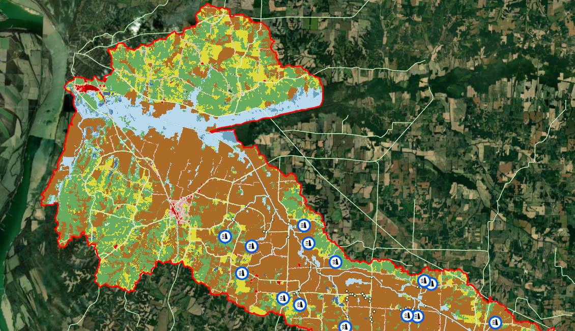 Color-coded map of land use or zoning within a defined area, with blue icons indicating locations of water facilities or utilities.