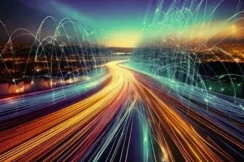 Light trails and digital effects representing high-speed technology and data transfer on a cityscape at night.