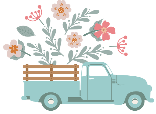 A vintage blue pickup truck carrying a wooden crate overflowing with pink and white flowers with green leaves.