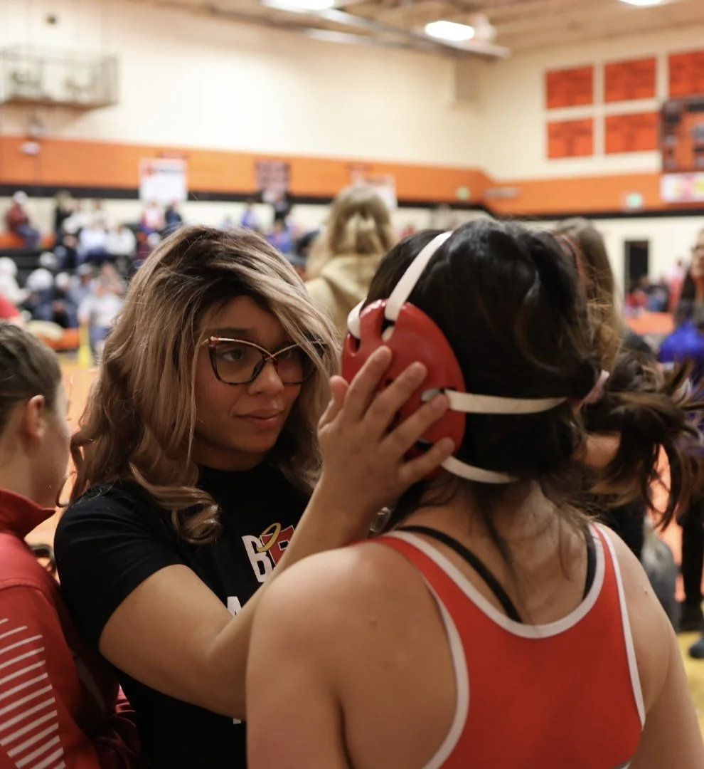 Maya Nelson holds face of her student