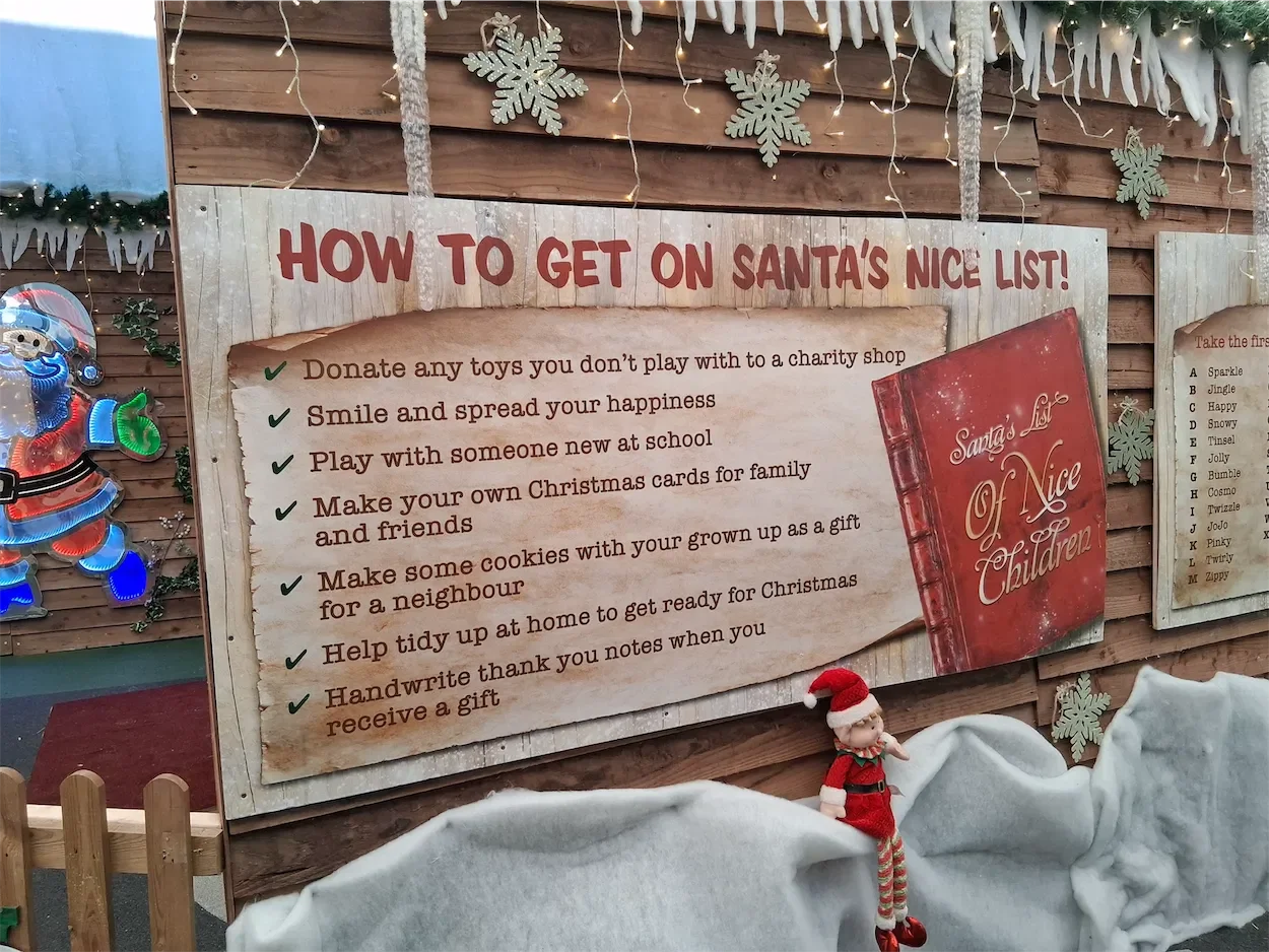 A view of the Santa set at Willow Activity Farm with a sign explaining how to get on Santa's list