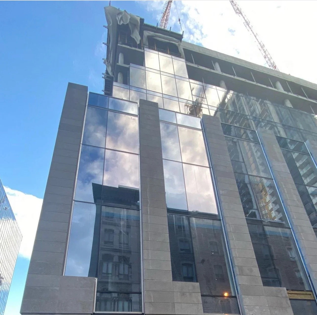 Victoria sur le Parc high-rise construction featuring Ottawa Platinum limestone façade by Broccolini in Montreal