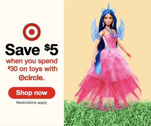 A promotional advertisement from Target offering a $5 discount on toy purchases of $30 or more, featuring a doll dressed as a pink princess with blue wings and a blue unicorn horn, standing on green grass.