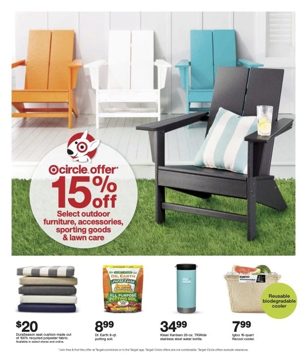Outdoor furniture display with colorful chairs and a promotional sign offering 15% off. Items shown include a black outdoor chair with a striped pillow, a reusable biodegradable cooler, a stainless steel water bottle, and a bag of potting soil.