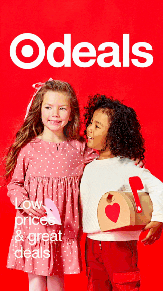 Two young girls, one with blond hair and the other with curly dark hair, standing in front of a red Target logo backdrop. The girl with blond hair is wearing a pink polka-dot dress, and the girl with curly hair is holding a small tote bag. The text on the image reads 'Low prices & great deals.'