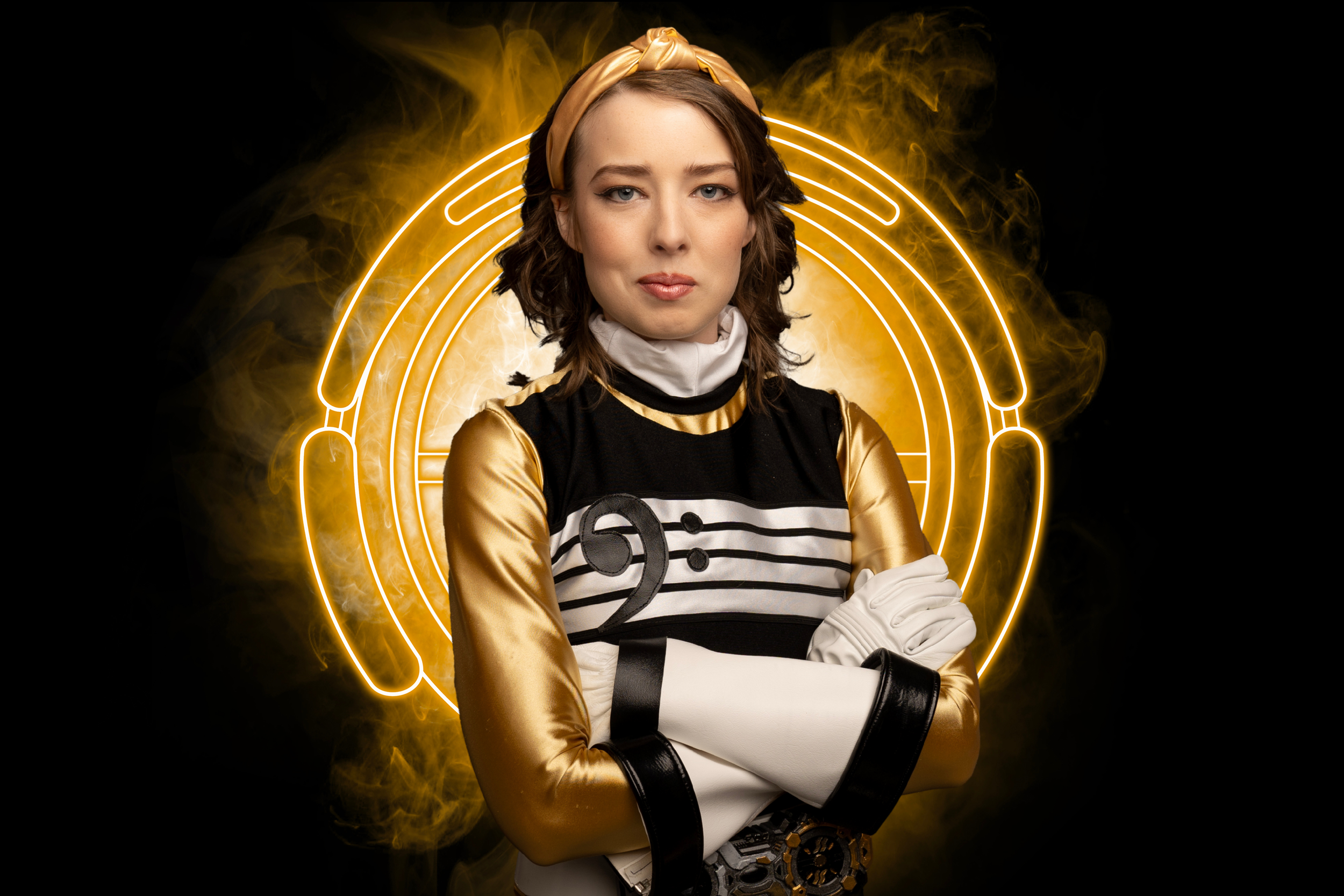 Portrait of Rei, a young woman in her golden Jammingers suit.