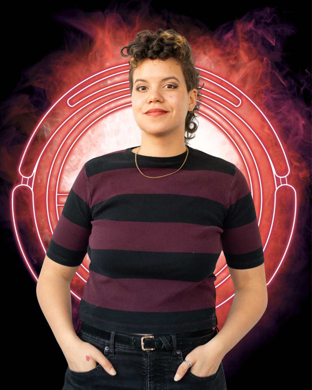 Portrait of Synestra, a femme person with a closed-mouth, knowing smile.