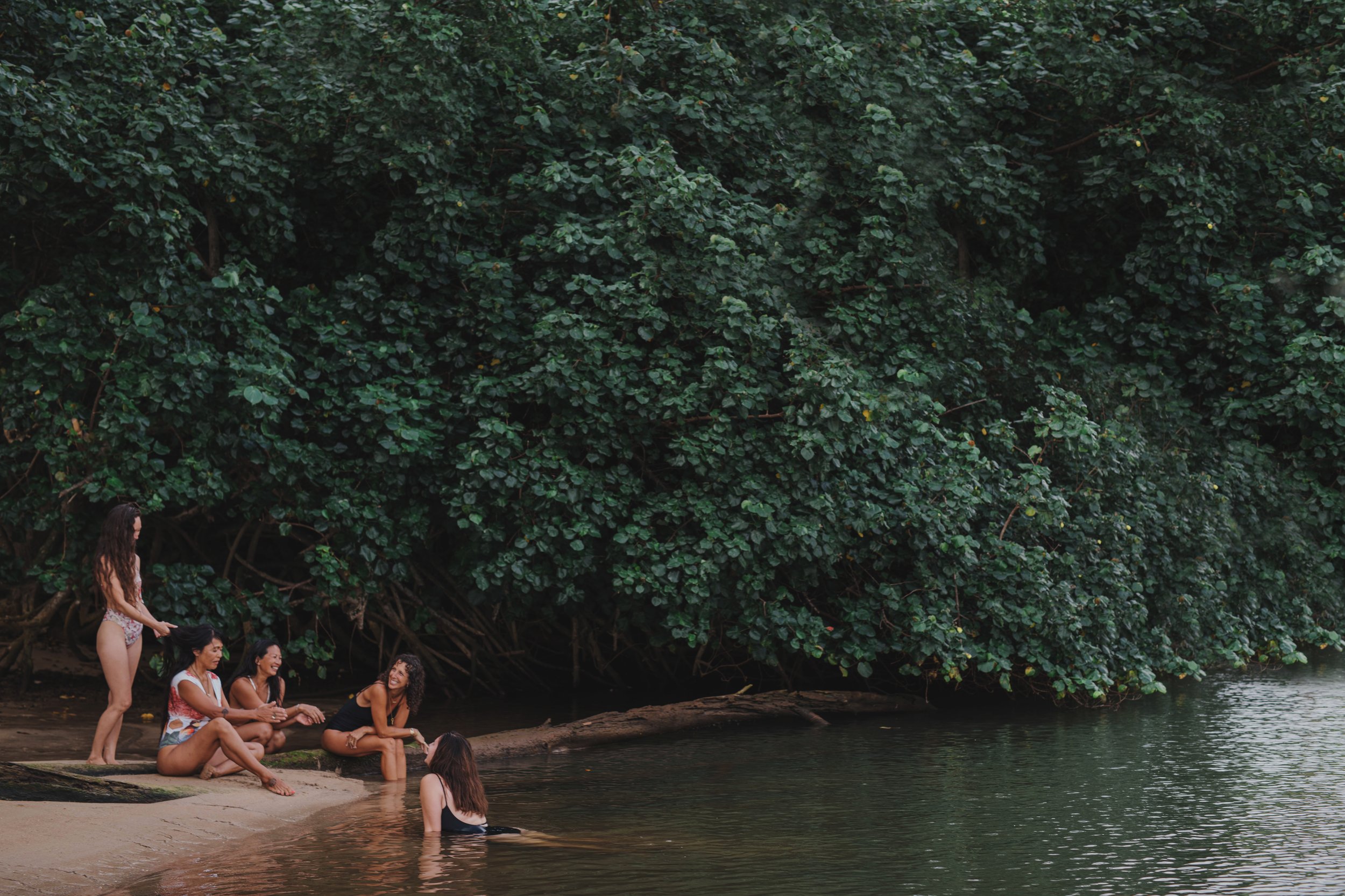 women swimming together in the ocean on Oʻahu