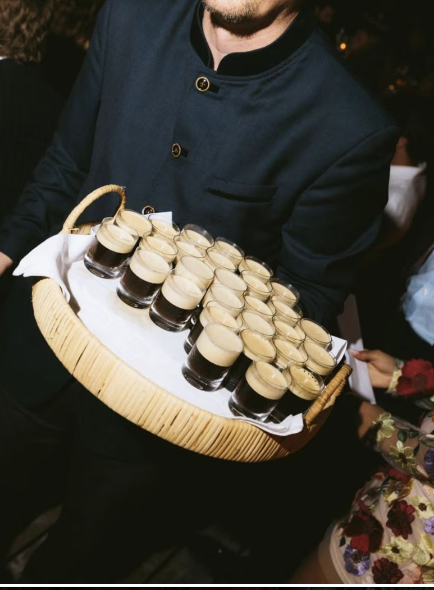 Guests gathering around the Le Cruz wedding coffee bar