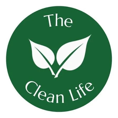 Green circle logo with two white leaves in the center and the text "The Clean Life" around it.