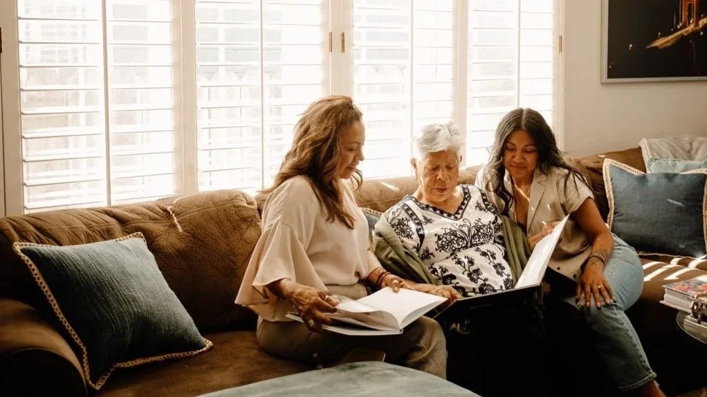 Family preparing to move into senior living setting enjoying memories