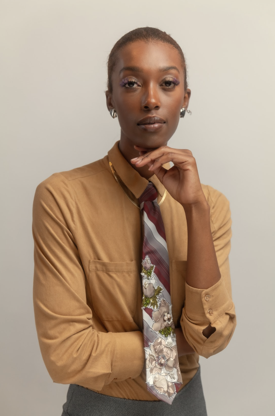 Pre-loved, upcycled burgundy + white tie with floral and bead appliqué by Ela é. Diferente