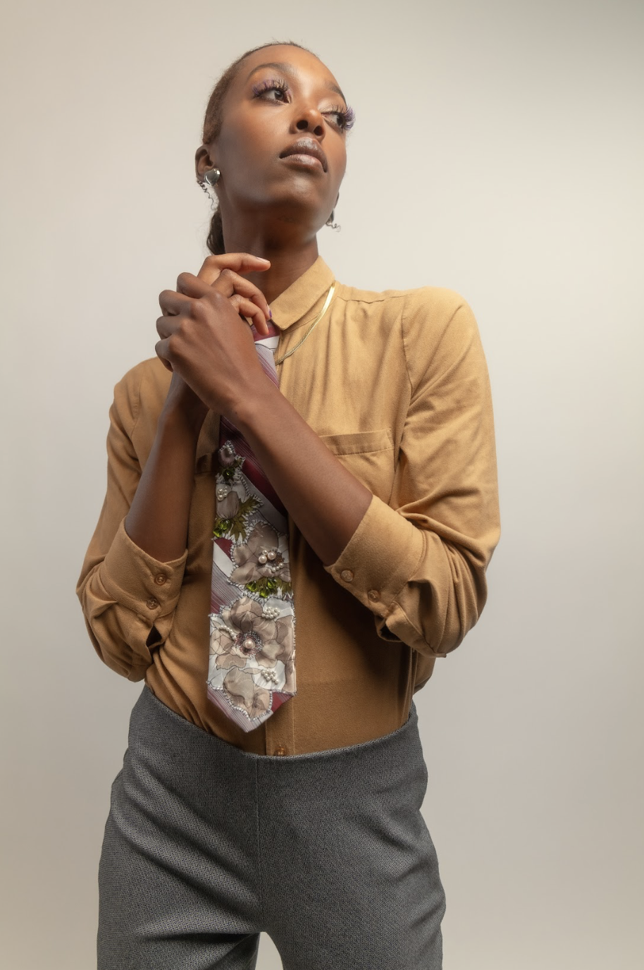 Pre-loved, upcycled burgundy + white tie with floral and bead appliqué by Ela é. Diferente