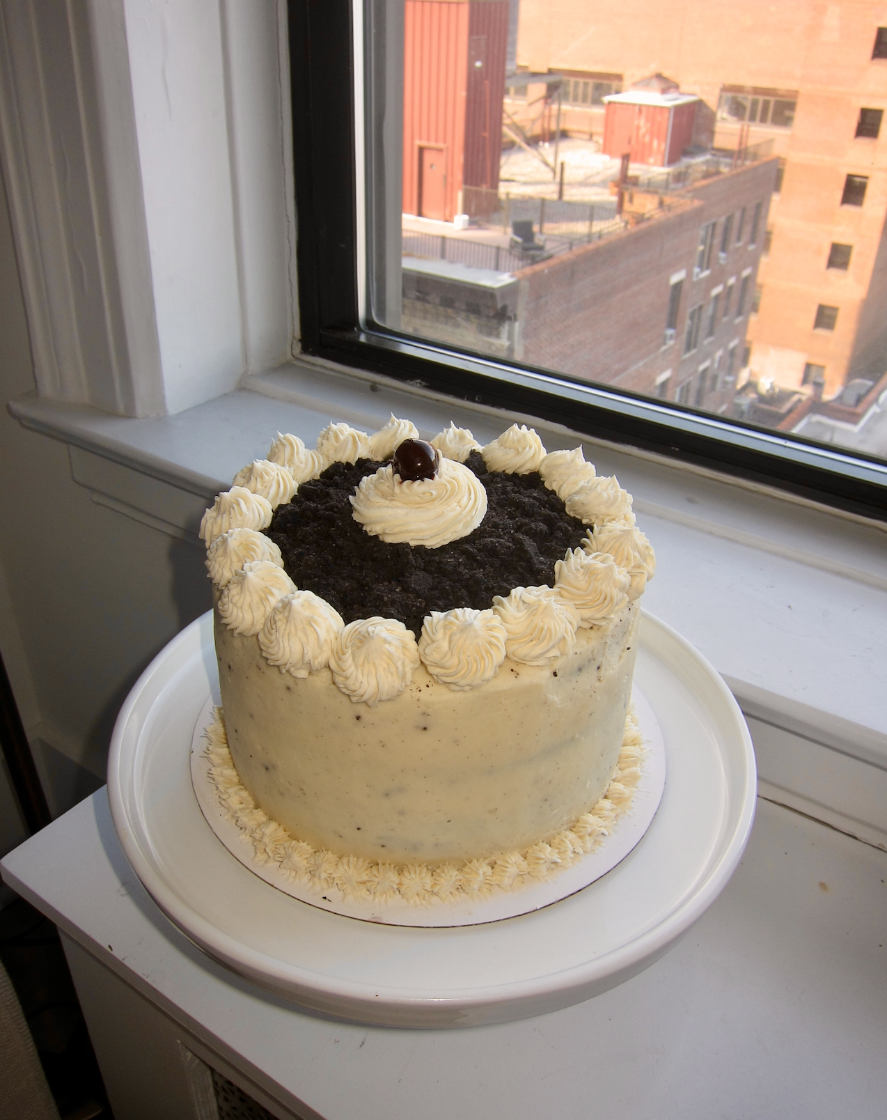 Black forest cake with amaro cherry soaked layers,  chocolate ganache, and black cocoa crumb topping. 