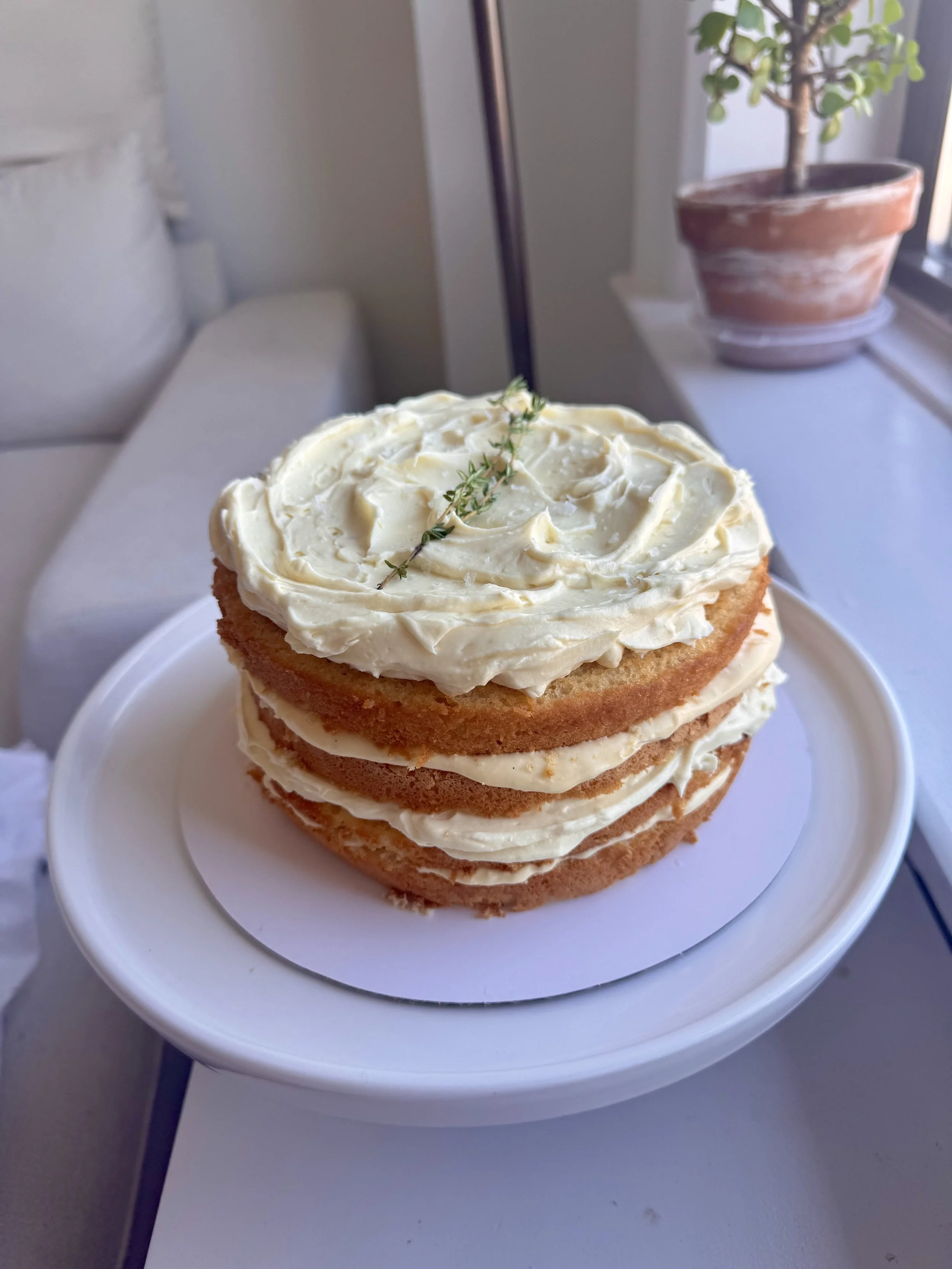 Lemon chiffon cake, lemon curd cream cheese filling, and thyme swiss meringue buttercream 