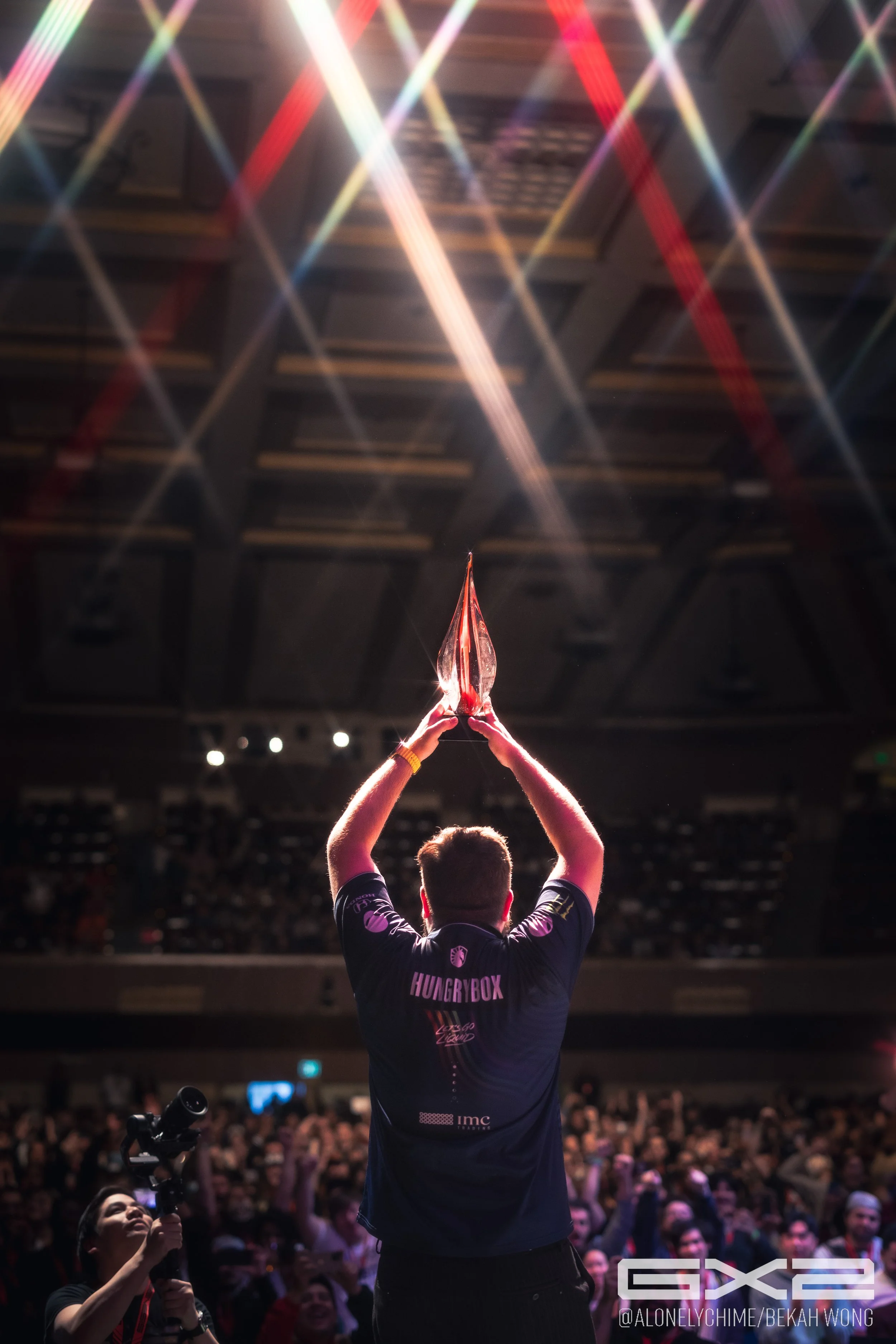 Hungrybox lifts trophy above his head after winning Genesis X2 Melee grand finals