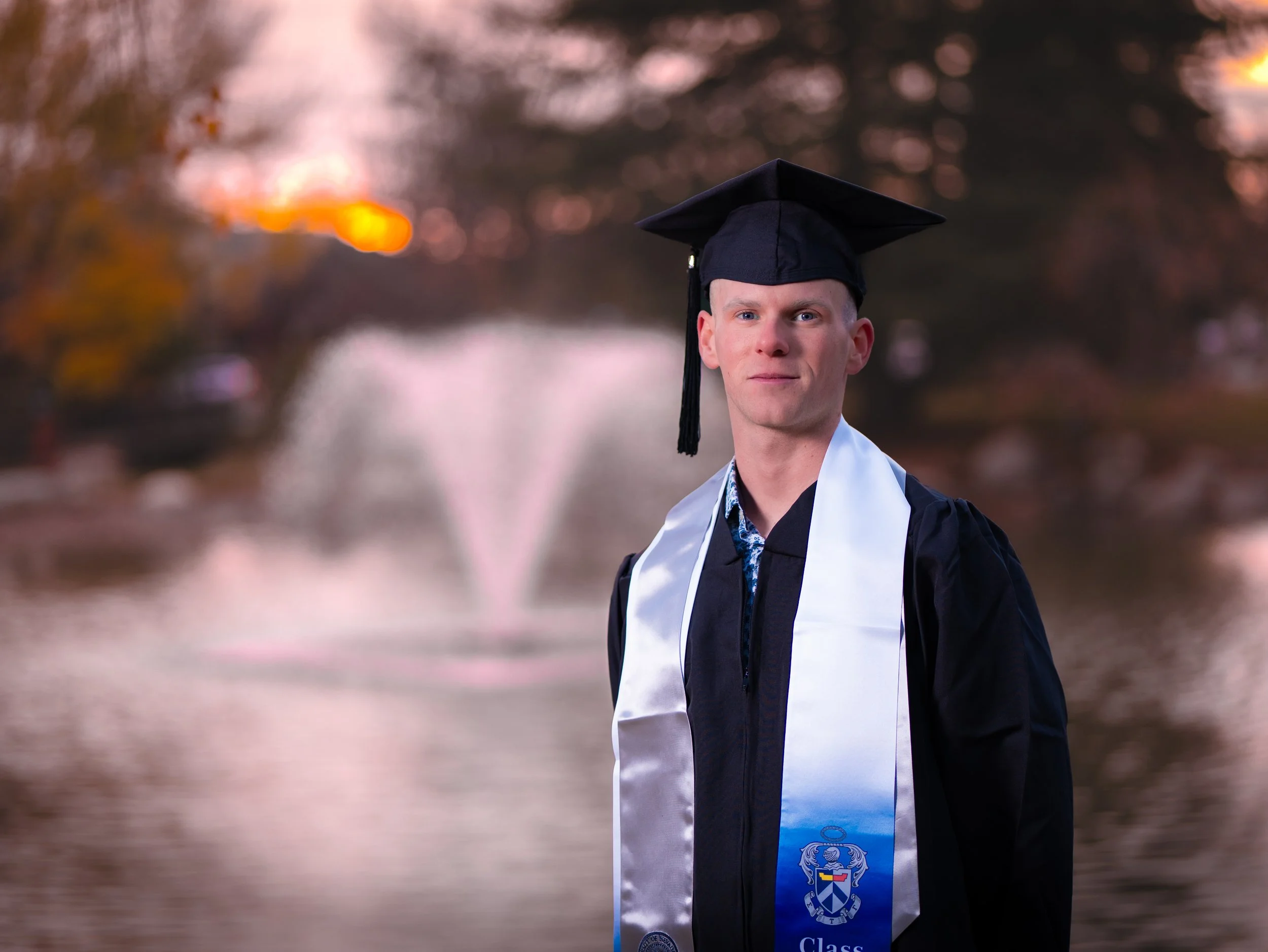 A young man in a professional graduation photo taken in Reno, Nevada.