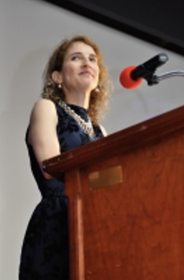 Kinney giving a speech in Washington, DC, 2015