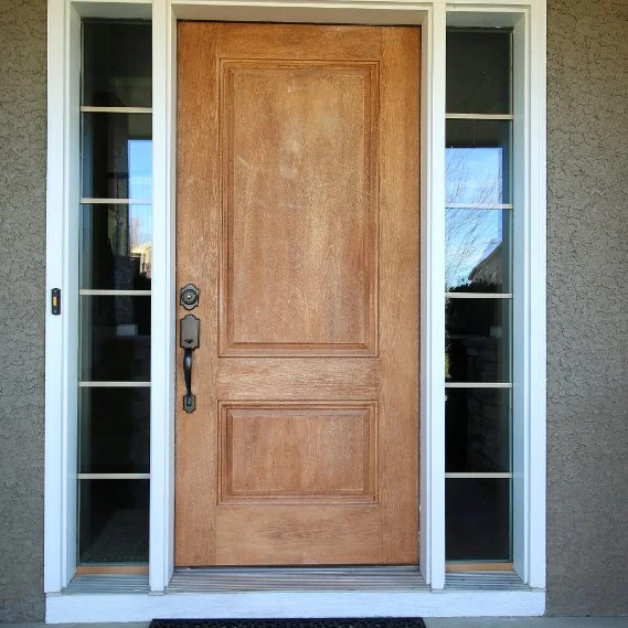 Front entrance door with glass sidelights on either side