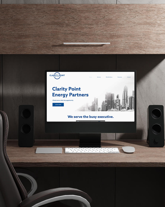 Clarity Point Website Homepage on Corporate Desk Screen Mockup