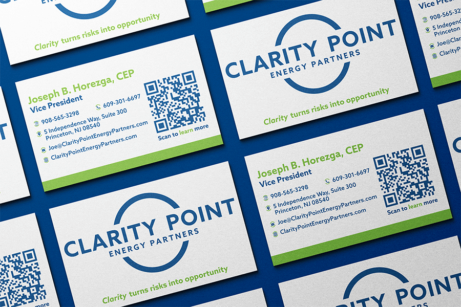 Repetitive pattern on blue background of front and back of Clarity Point's business cards
