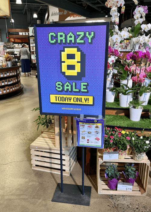Photo of in-store poster stanchion sign holder and flyers for McCaffrey's crazy 8 sale