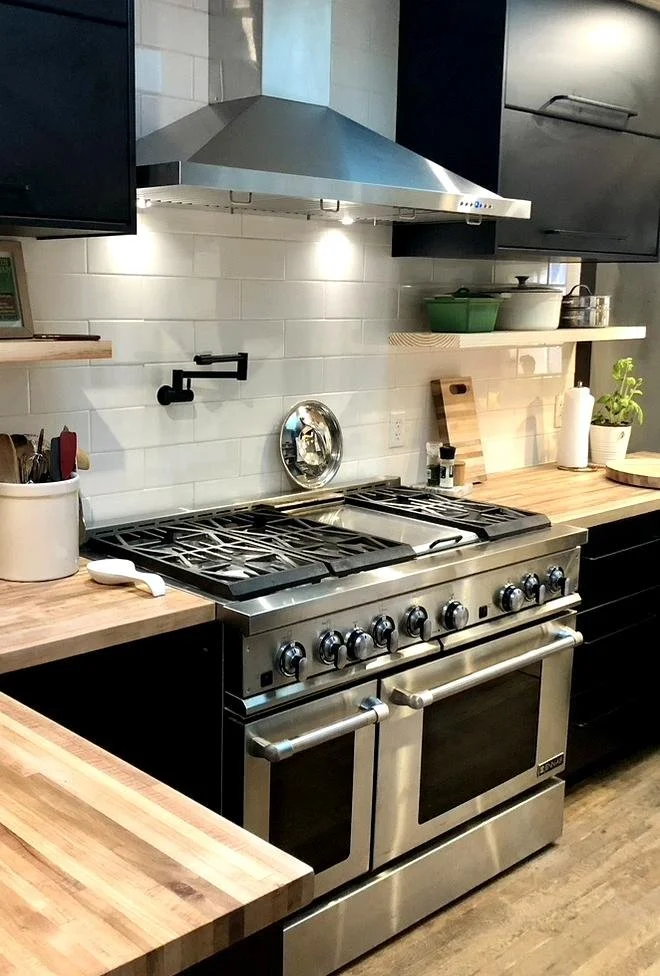 Remodeled kitchen featuring 48" range and butcher block counters