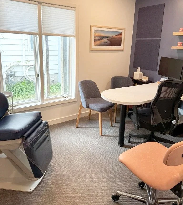 Consult room at orthodontic practice featuring blue decor