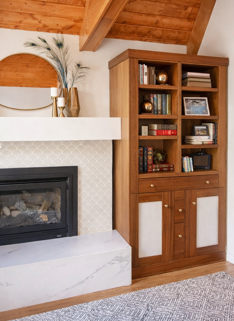 Living room with tiled fireplace and built-in bookshelves