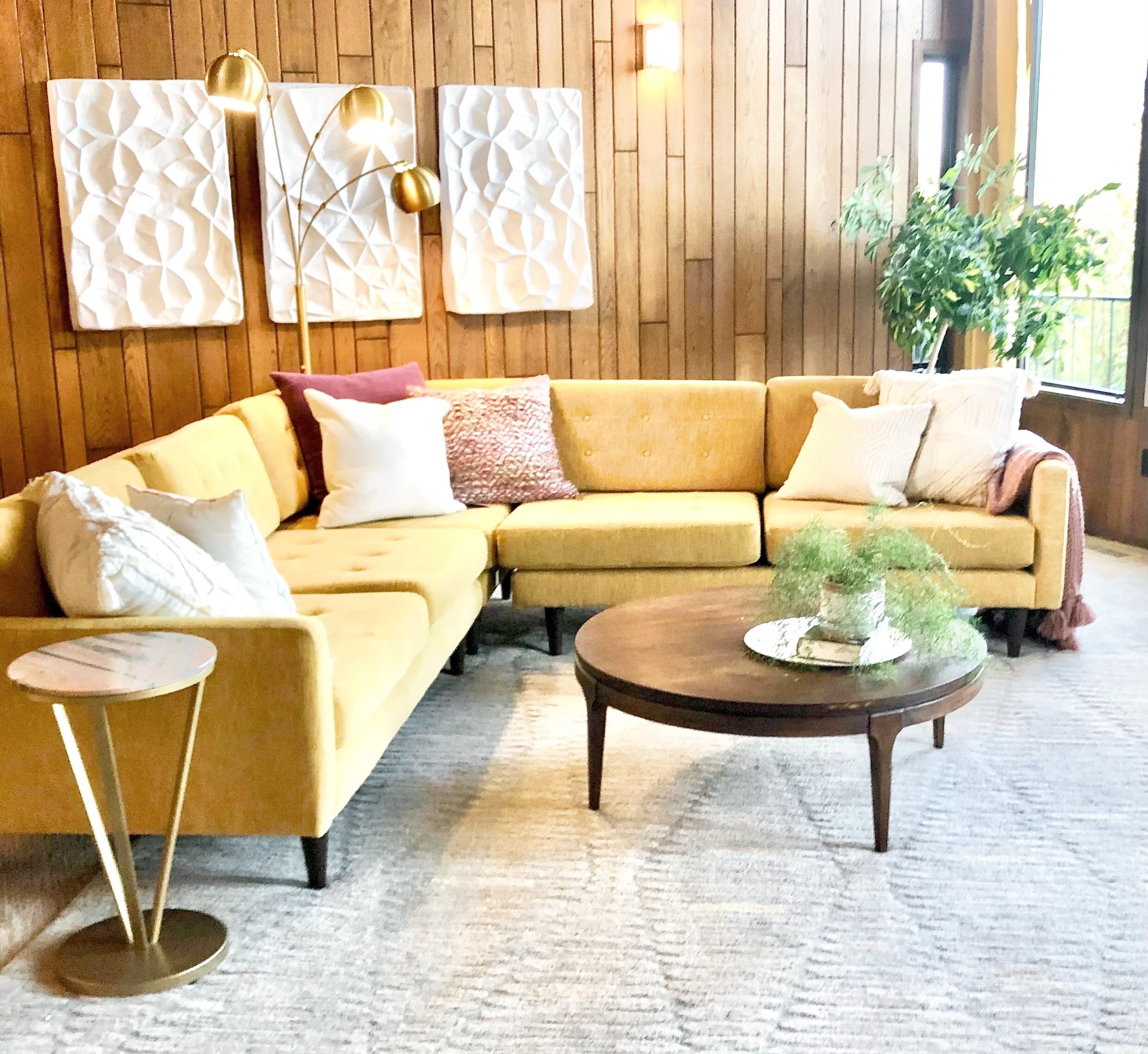 Seventies inspired living room featuring yellow sectional sofa