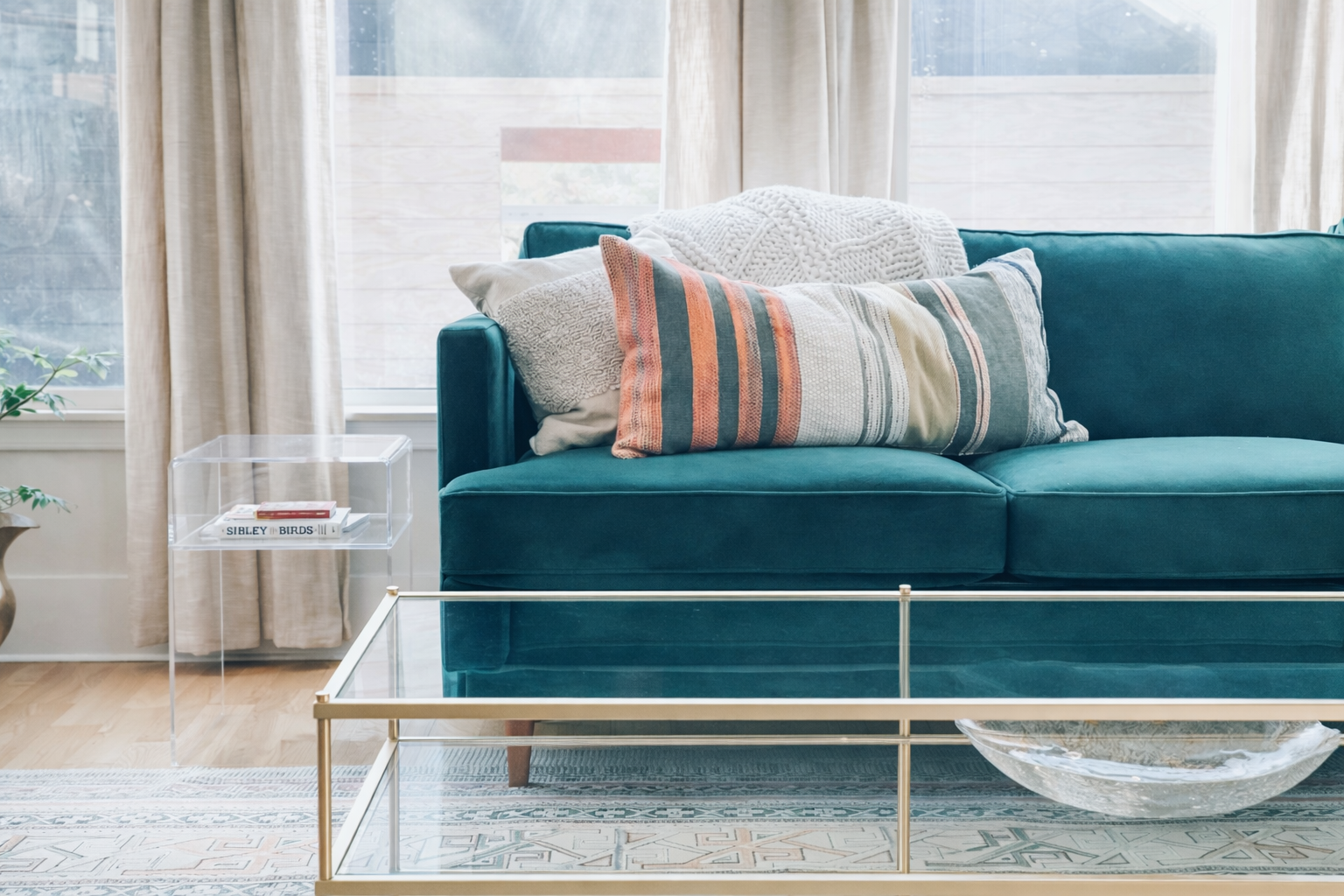 Family room featuring jewel toned green sofa