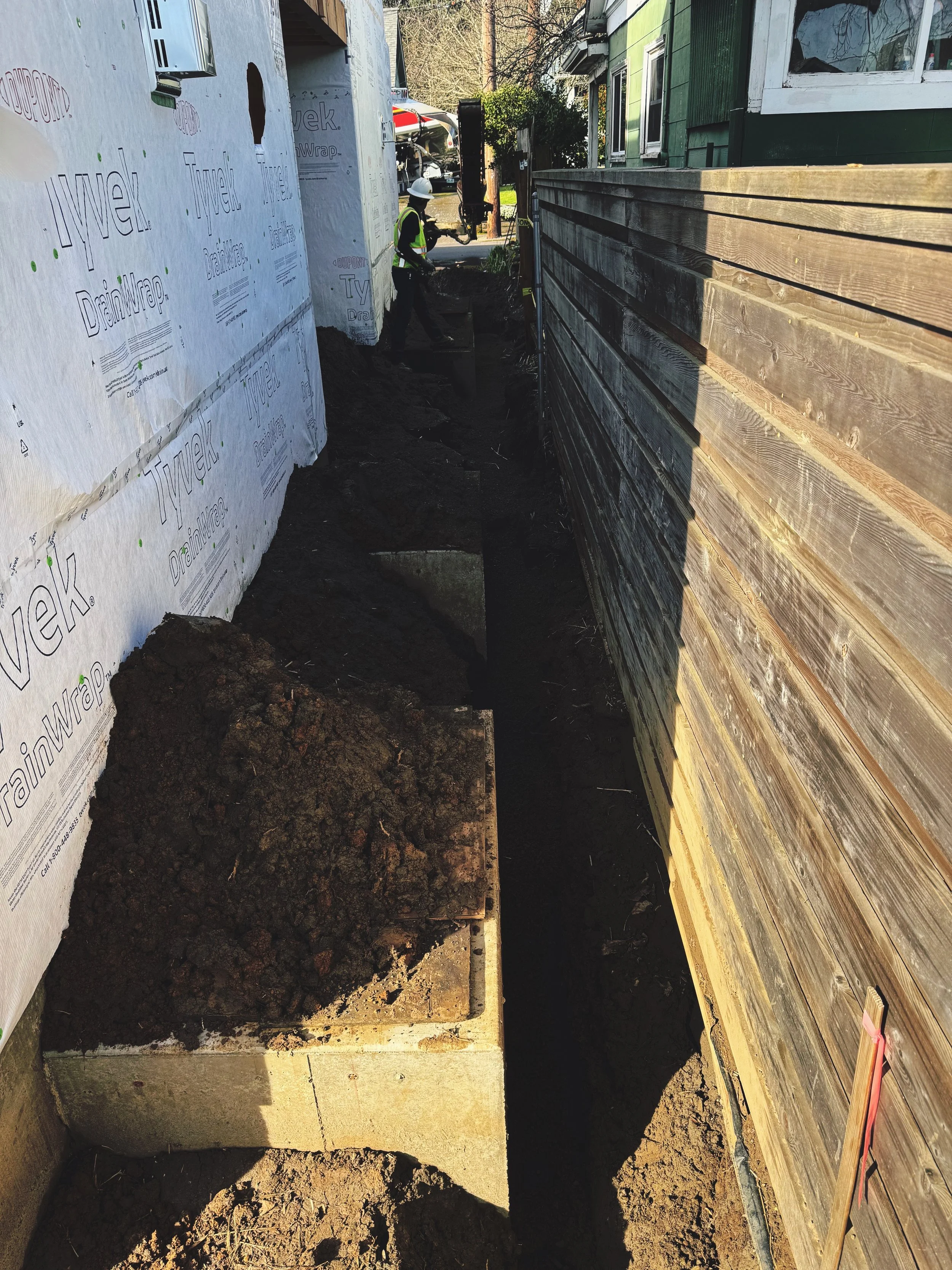 16 Yards of 3/4-0" Placed Through a Staircase Into a Basement — NE Portland Residential Construction