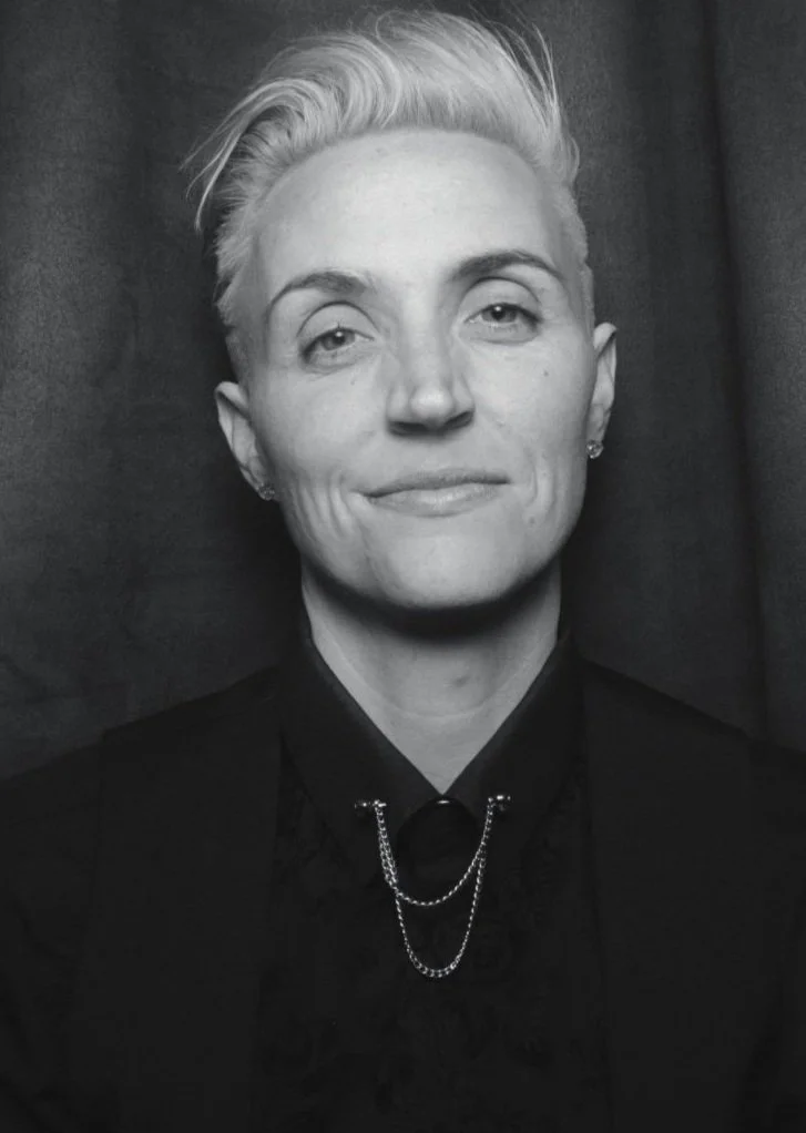 black and white headshot of lo