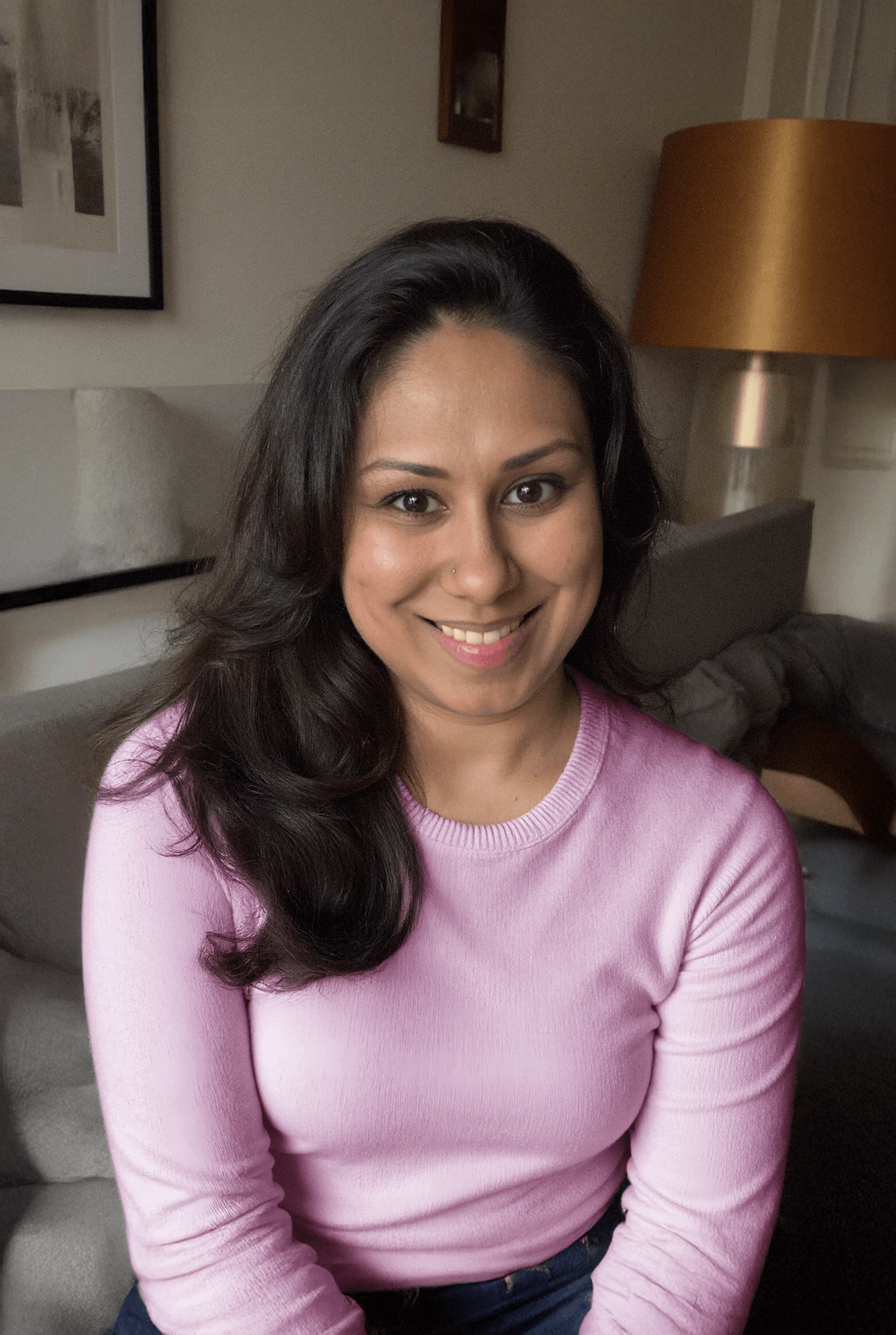 Lady in pink top with modern interior background