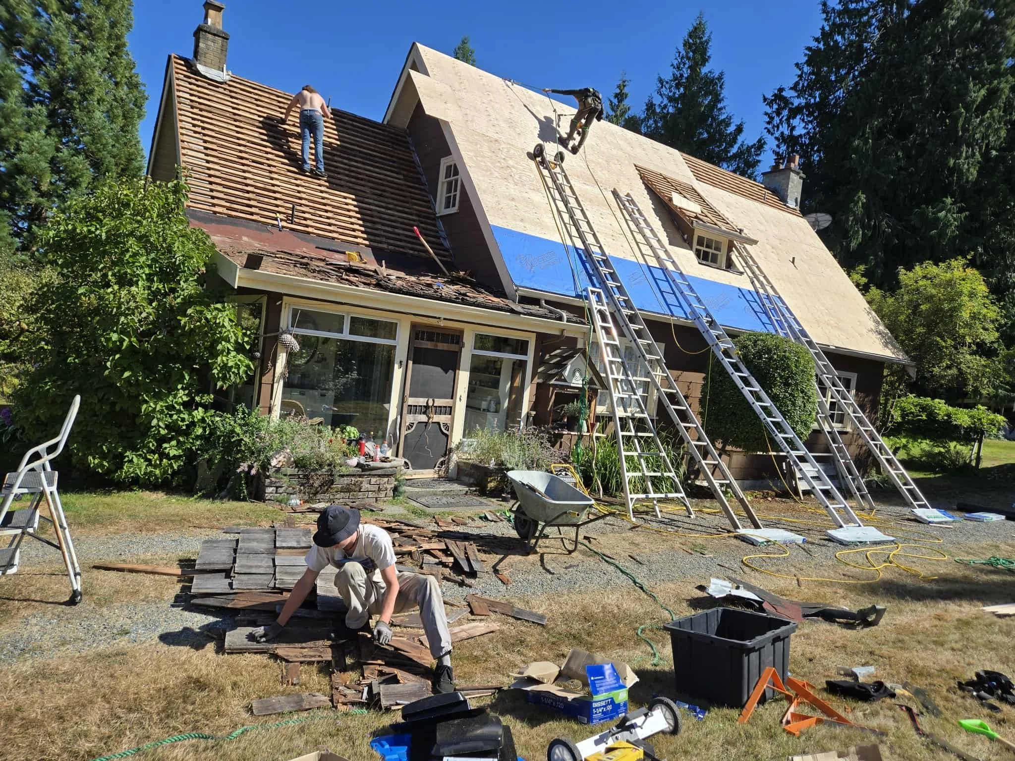 Roofers replacing a roof