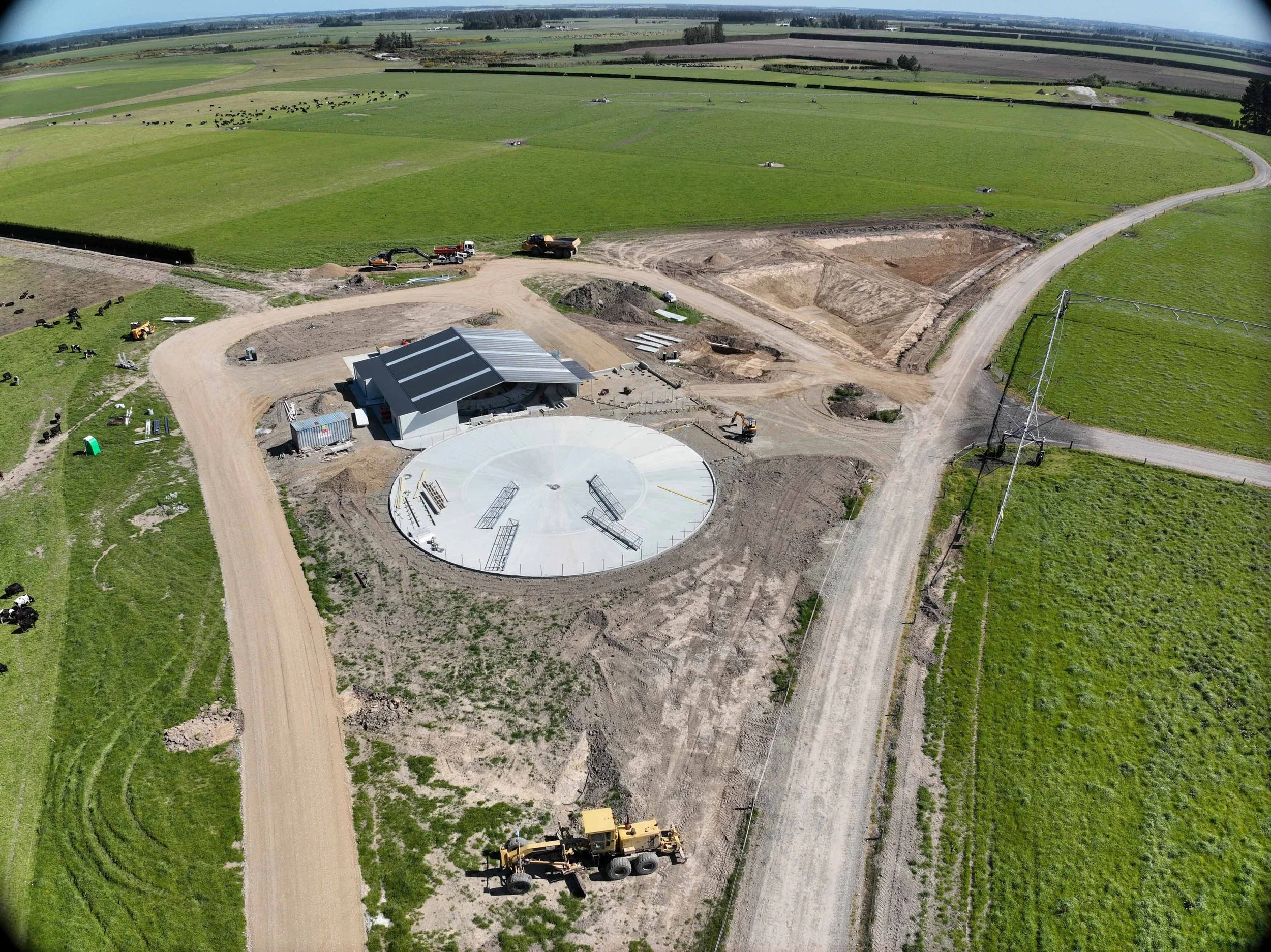  Canterbury rotary dairy shed development designed for efficient milking and cow flow built by Rural Building Solutions, featuring a Donald Engineering Rotary Platform, Earthworks by Densem Contracting 2010 Ltd, Refrigeration by Dairycool, Feed silos