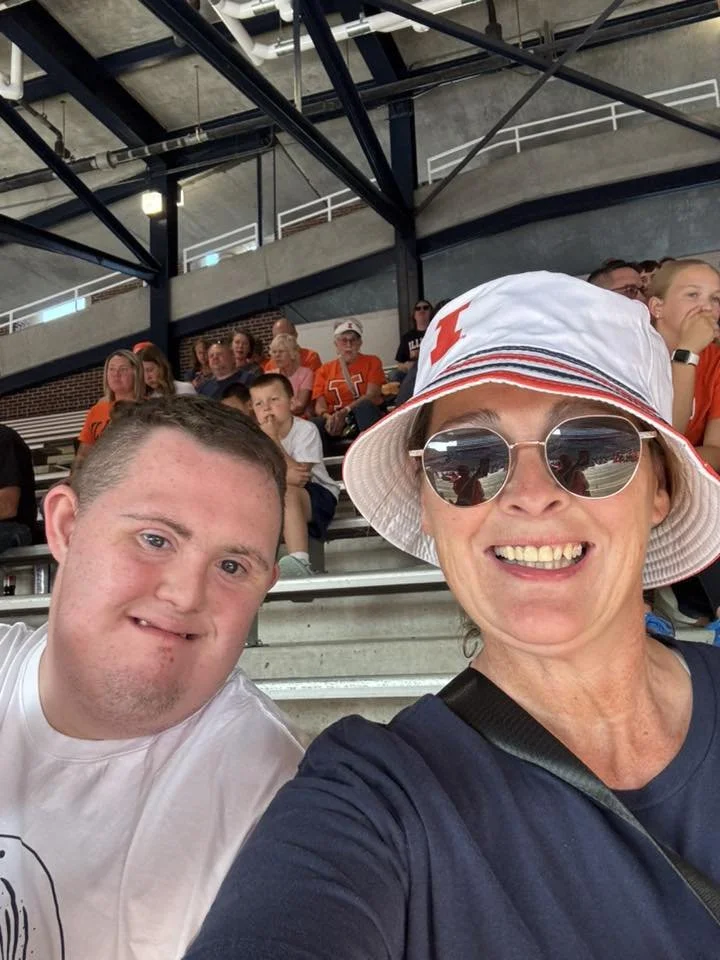Chance and his mother, Amanda, smiling together at a sporting event and enjoying time together.